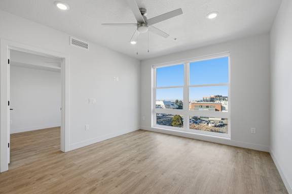 Room with shiny wooden floor at Brickside Heights, Millcreek