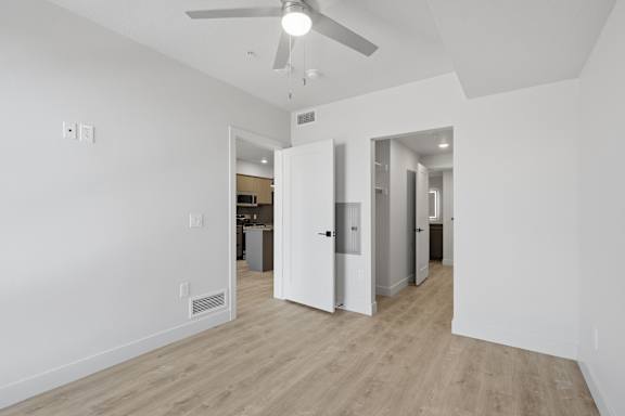White room with ceiling fan at Brickside Heights, Millcreek, UT
