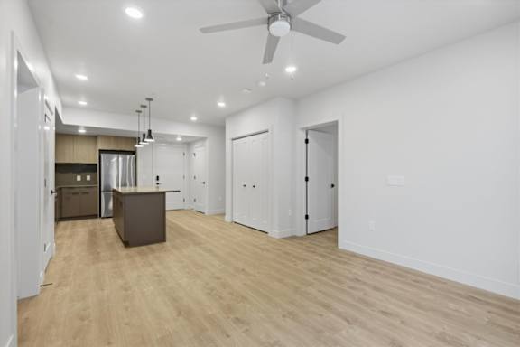 Spacious room and kitchen with ceiling fan1 at Brickside Heights, Millcreek, UT, 84106