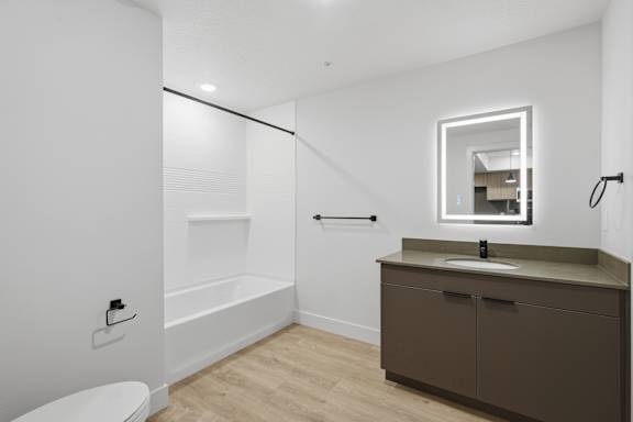Bathroom with mirror and vanity at Brickside Heights, Millcreek, UT, 84106