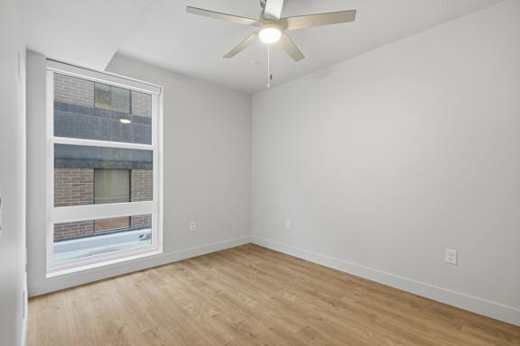 Room with large glass window at Brickside Heights, Millcreek, Utah