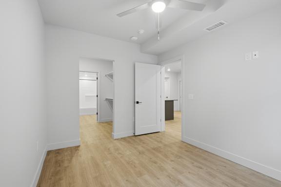 Room with white walls and wooden floor at Brickside Heights, Millcreek, 84106