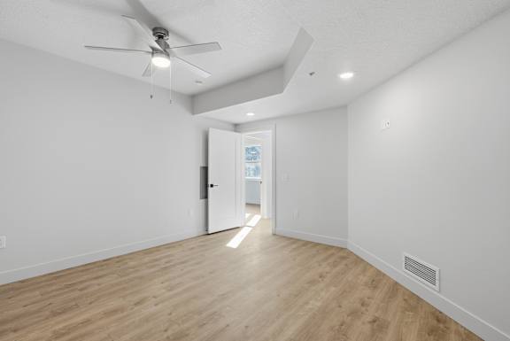 Ceiling fan with light in room at Brickside Heights, Millcreek, Utah