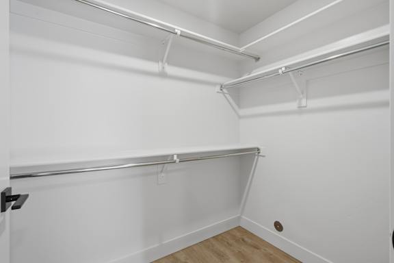 Large Empty closet with wooden shelves at Brickside Heights, Millcreek, Utah