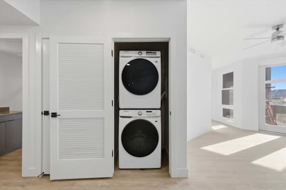 White laundry room with a washer and dryer in it2 at Brickside Heights, Millcreek, Utah