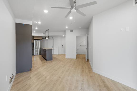 Room with lights and ceiling fan at Brickside Heights, Millcreek, UT, 84106