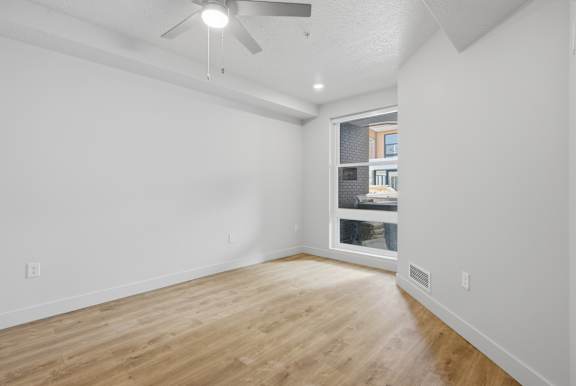 Room with a ceiling fan and a window at Brickside Heights, Millcreek