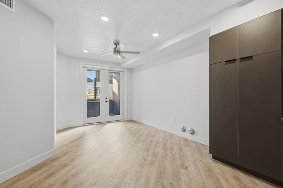 Room with closet and ceiling fan at Brickside Heights, Millcreek, Utah