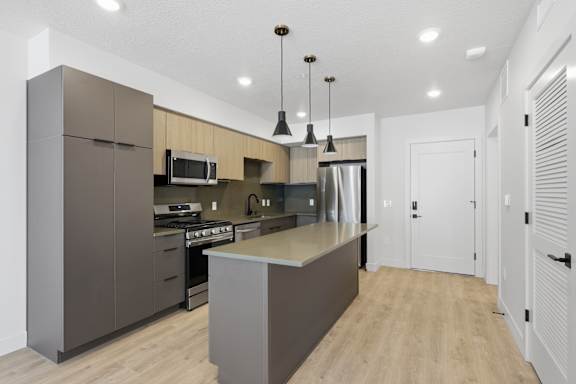 Fully equipped kitchen with appliances at Brickside Heights, Millcreek, Utah