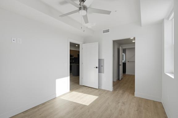 White Room with attached bath and ceiling fan at Brickside Heights, Utah