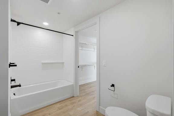 White Bathroom with Tub at Brickside Heights, Millcreek
