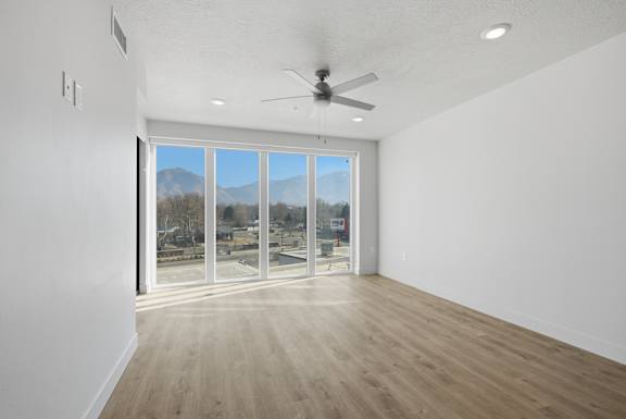 Room with glass doors at Brickside Heights, Millcreek, 84106