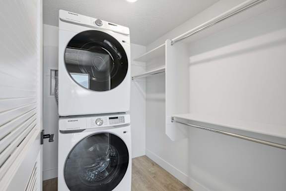 Laundry area with washing machine near doorway at Brickside Heights, Millcreek, UT