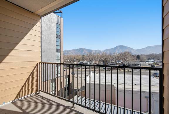 Balcony with sunlight at Brickside Heights, Millcreek, UT