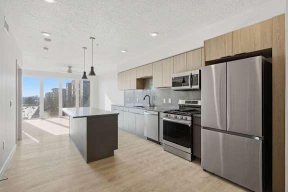 Kitchen with Large Refrigerator at Brickside Heights, Millcreek, Utah
