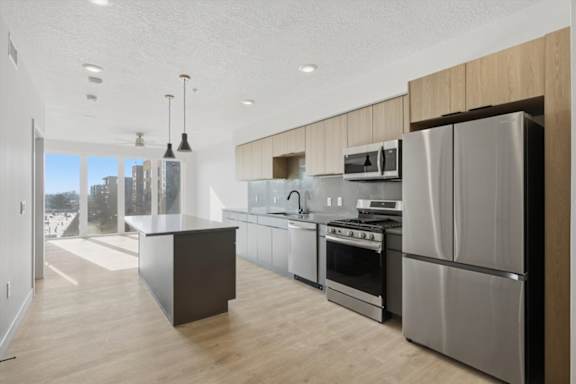 Kitchen with Large Refrigerator4 at Brickside Heights, Millcreek, UT