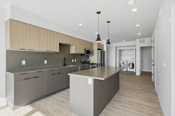 Kitchen with modern stove and oven setup at Brickside Heights, Millcreek, UT, 84106