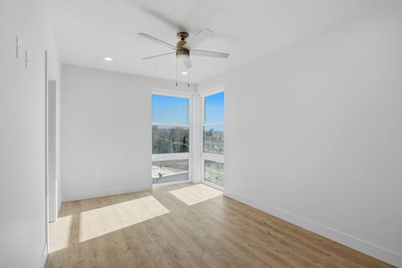 Room with windows and ceiling fan1 at Brickside Heights, Millcreek, 84106
