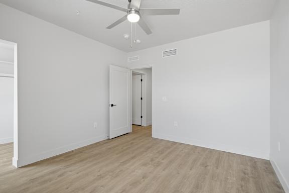 Large and Vacant room with ceiling fan at Brickside Heights, Millcreek, Utah