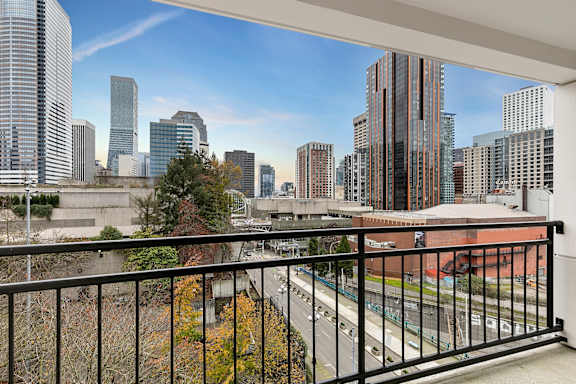 Balcony overlooks a cityscape with tall buildings3 at AVIA on Pike Street, Washington, 98101