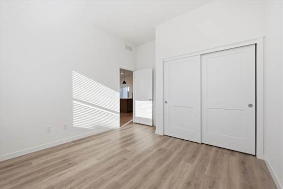 Unfurnished room with white door at Alante Homes at Spring Run, Caldwell