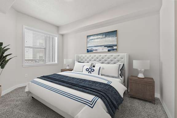 Bedroom With Expansive Windows at The Flats at Riverwoods, Provo