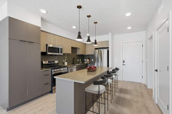 Kitchen with built-in storage cabinets at Brickside Heights, Millcreek, Utah