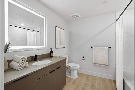 Bathroom with shower and curtain setup at Brickside Heights, Millcreek