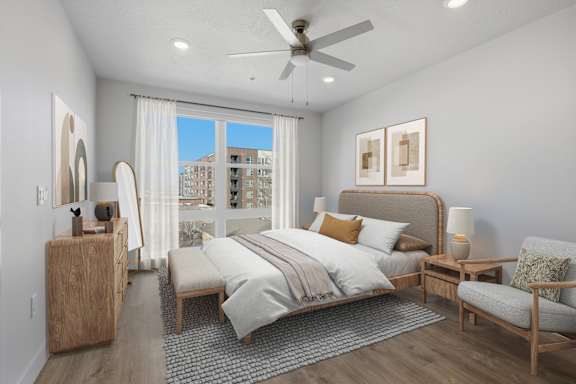 Bedroom with full size mirror at Brickside Heights, Millcreek
