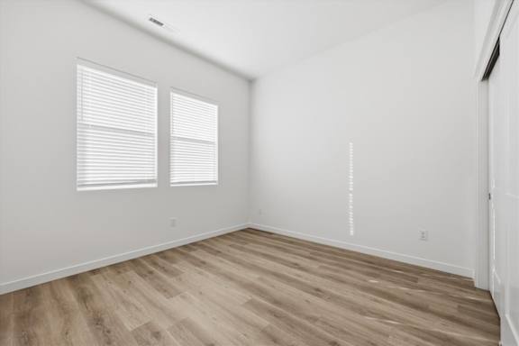 Window with blinds in vacant room at Alante Homes at Spring Run, Caldwell