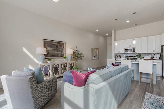 Living room with couch and kitchen view1 at 200 City View, Provo, 84601