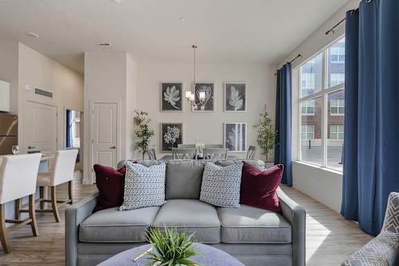 Living room with grey couch at 200 City View, Provo, Utah, 84601