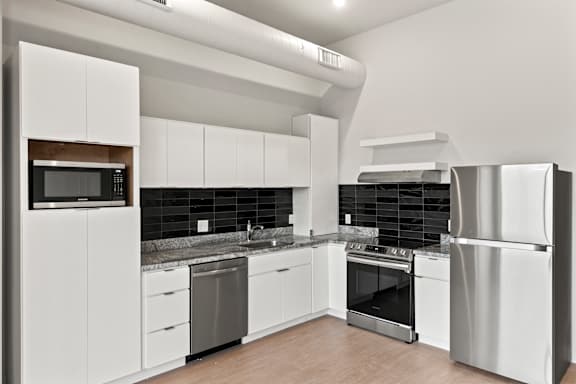 Modern kitchen with appliances at Brickside Heights, Millcreek, 84106