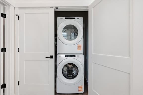 Front loading machines in laundry room at Alante Homes at Spring Run, Caldwell