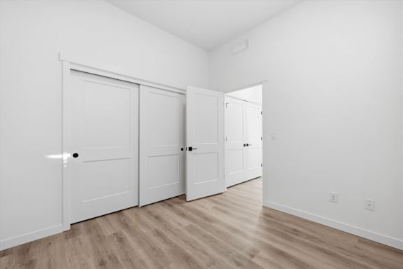 Hardwood floor in a vacant room at Alante Homes at Spring Run, Caldwell, ID