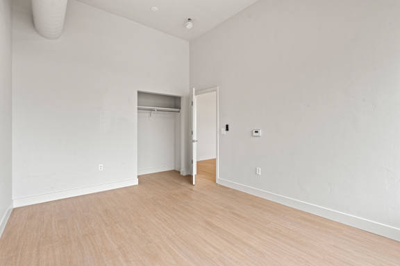 Vacant room with wooden floor at Brickside Heights, Millcreek