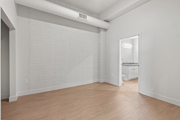 Vacant room with attached bath at Brickside Heights, Utah