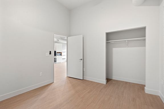 Bedroom with attached closet at Brickside Heights, Utah