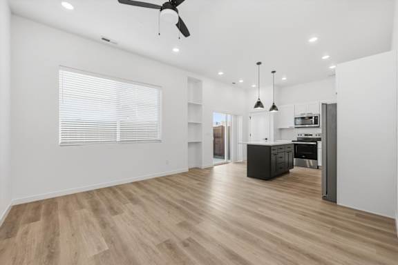 Spacious Living room and well equipped kitchen at Alante Homes at Spring Run, Idaho, 83607