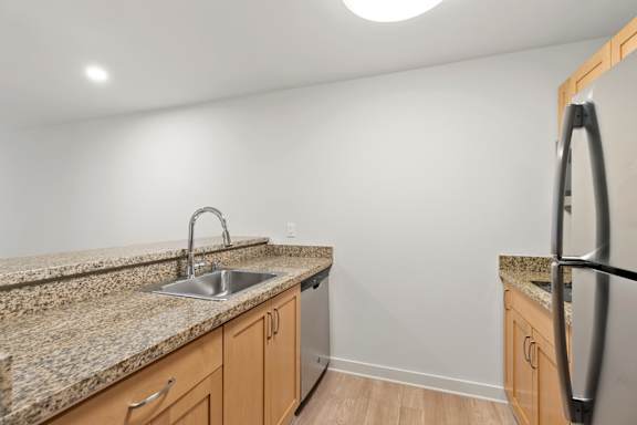 Kitchen with stainless steel sink1 at AVIA on Pike Street, Washington, 98101