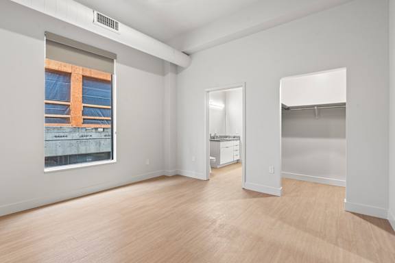 Room with attached closet and bathroom at Brickside Heights, Millcreek, 84106