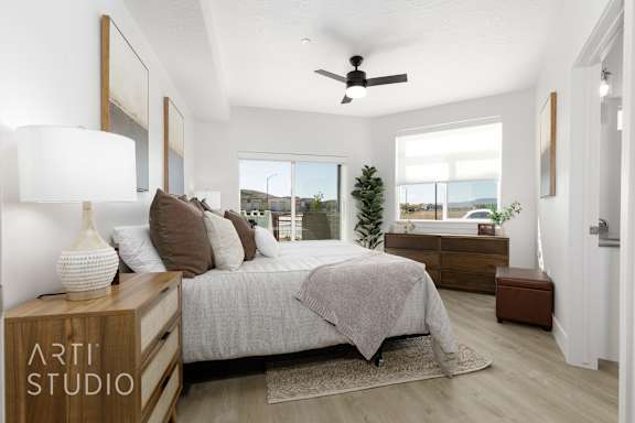 Bedroom with nightstand and lamp at The Vue At Desert Color, St. George, UT