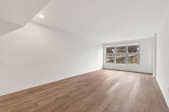 Large Vacant room with wooden floor1 at AVIA on Pike Street, Washington, 98101