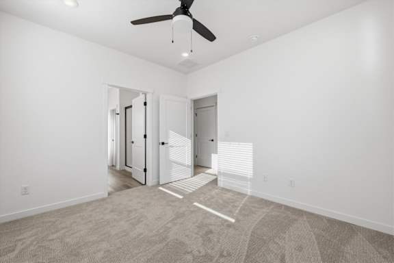 Carpeted floor in a vacant room with ceiling fan at Alante Homes at Spring Run, Caldwell, 83607