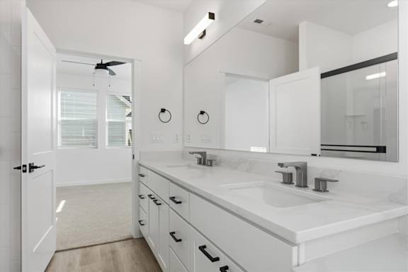 White Bathroom with large mirror at Alante Homes at Spring Run, Idaho