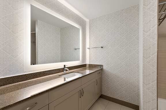 Bathroom with mirror and light at AVIA on Pike Street, Seattle, 98101