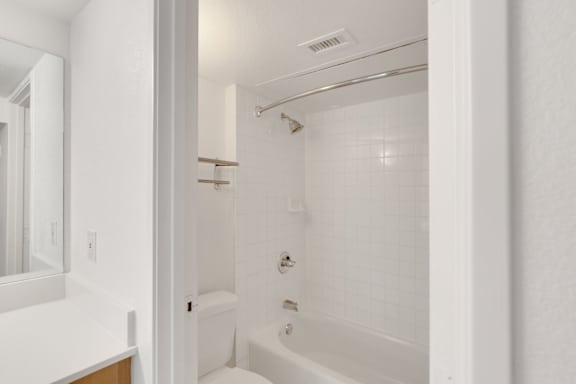 White Bathroom Interior with Shower at AVIA Apartments On Alpha, Dallas, Texas