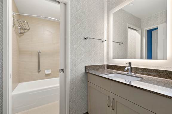 Bathroom with sink and faucet at AVIA on Pike Street, Seattle, 98101