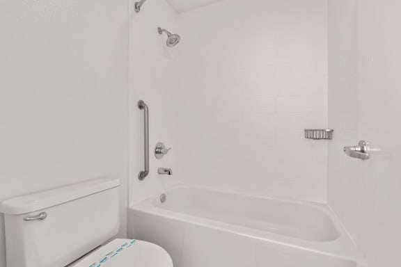 white bathroom with white bathtub at AVIA Lofts on Parkway, Vancouver, 98662