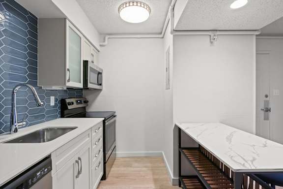 Kitchen with a marble counter at AVIA Lofts on Liberty Ridge, Jacksonville, 32256